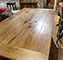 Custom farm tables are built by hand with a quality finish.